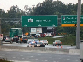 Files: Police divert traffic off of the westbound lanes of Highway 401 after heavy rain flooded the portion of the highway on Thursday, June 13, 2013. (Jason Kryk/The Windsor Star)