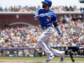 Toronto's Jose Bautista hits a single that scored R.A. Dickey in the fifth inning  against the San Francisco Giants at AT&T Park Wednesday. (Photo by Ezra Shaw/Getty Images)