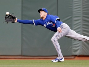 Toronto's Colby Rasmus cannot make a catch on a fly ball from San Francisco's Marco Scutaro. (AP Photo/Marcio Jose Sanchez)