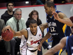 Windsor's Darren Duncan, left, fakes a drive to the basket against Saint John's Cavell Johnson at the WFCU Centre. (NICK BRANCACCIO/The Windsor Star)