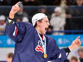 Team USA defenceman Patrick Sieloff of the Spitfires celebrates after defeating Sweden during at the world junior championships in Ufa, Russia. (THE CANADIAN PRESS/Nathan Denette)