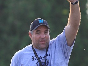 Essex Ravens coach Glen Mills runs a drill at practice in Essex. (JASON KRYK/ The Windsor Star)