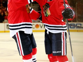 Chicago's Brent Seabrook, left, and Patrick Kane celebrate after Kane scored a goal in the first period against the Los Angeles Kings during Game 5 of the Western Conference final in Chicago. (Photo by Gregory Shamus/Getty Images)