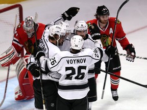 Anze Kopitar, Jeff Carter, Slava Voynov, Mike Richards and Drew Doughty celebrate after Kopitar scored a goal in the third period against the Chicago Blackhawks during Game 5 of the Western Conference final in Chicago.(Photo by Jonathan Daniel/Getty Images)