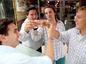 Tyler Van Norman, left, Anthony Savedes, Christian Michalik and Karsten Heppler toast shots of tequila in downtown Windsor on Saturday, June 22, 2013. The group from Michigan came to Windsor to celebrate Savedes and Van Norman's 19th birthdays. (REBECCA WRIGHT/ The Windsor Star)