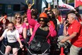 Driver Gary Blaire whips up Sydney Lewis (left) and Nadene McKenzie (centre) before they head out on the Heart and Stroke big bike through the streets of Windsor on Tuesday, June 4, 2013.             (TYLER BROWNBRIDGE/The Windsor Star)