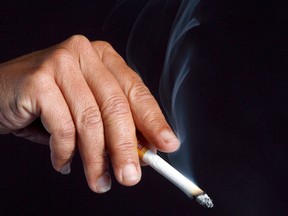 A person holds a cigarette in this file photo. (JASON KRYK/The Windsor Star)