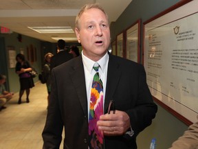 Larry Horwitz, chair of the Downtown Windsor BIA comments on the latest developments with the Pelissier St. parking garage at a city council meeting Tuesday, June 4, 2013, in Windsor, Ont.  (DAN JANISSE/The Windsor Star)