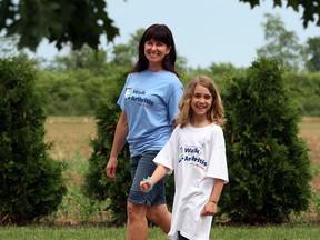 Clairissa Raymont, 8, and her mother, Terri Raymont, go for a short stroll recently in preparation for the Walk to Fight Arthritis on June 9 at Malden Park. (NICK BRANCACCIO / The Windsor Star)