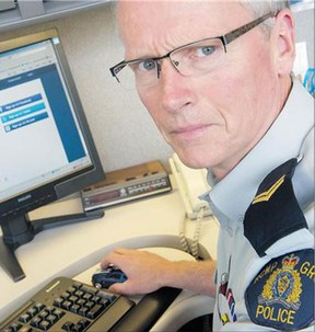 RCMP Cpl. Richard De Jong with the ask.fm website open on a computer in North Vancouver Thursday. 'It's really user beware,' De Jong said of this and similar websites.
(Gerry Kahrmann/Postmedia News)