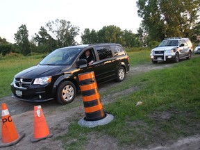 Windsor Police pulled the body of an unidentified male from the Detroit River near the intersection of Mill and Russell in the city's west end. A van carrying the body leaves the area at approximately 8:30 p.m. (DAN JANISSE/The Windsor Star)
