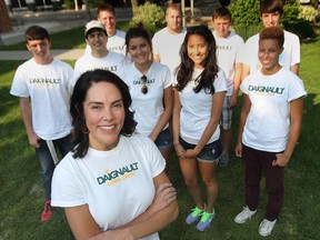 Michele Daignault, foreground, a Windsor-based contractor has been hiring students to detassel corn for 23 years. She poses recently with some of her crew members, including Travis Wilson, left, David Endo, Spencer Paddon, Katya Rowly, Brandon Malo, Josee Loshusan, James Pekuyauz, Maua Ohlmann and Isaac Seifarth. (DAN JANISSE / The Windsor Star)