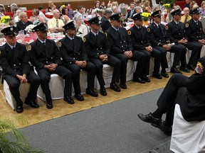 In this file photo, fire recruits and their training team sit at the front of the room during a swearing in ceremony at the Caboto Club in Windsor on Thursday, June 20, 2013. The new firefighters will now join the fire department as firefighters.               (TYLER BROWNBRIDGE/The Windsor Star)