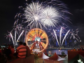 The 55th annual Ford Fireworks presented by Target light up the sky along the Detroit River between Detroit, Michigan and Windsor, Ontario on Monday, June 24, 2013. Thousands turned out and packed the riverfront for the annual event.                (TYLER BROWNBRIDGE/The Windsor Star)