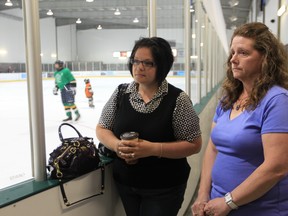 Hockey moms Audrey Tomes, left, and Jeannette Uras, support the Windsor Minor Hockey Association's new rule requiring parents to take a course in hockey etiquette.  Star photo/ EMMA LOOP)