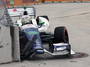 Simona de Silvestro crashes in the eighth turn during the IndyCar Detroit Grand Prix on Belle Isle in Detroit, Sunday, June 2, 2013. France's Simon Pagenaud won the race. (AP Photo/Carlos Osorio)