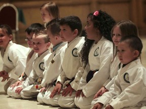 In Honour of the Ones We Love organization's Kids Beating Cancer Honourable Ninjas program held a belt ceremony Thursday, June 6, 2013, at the Ciociaro Club in Windsor, Ont. Here the kids get set to demonstrate some techniques.   (DAN JANISSE/The Windsor Star)