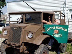 Geoff Bottoms steps into a vintage 1943 Ford F15AA, four-wheel drive military vehicle at his Drouillard Road garage, Monday July 26, 2010. (NICK BRANCACCIO/The Windsor Star files)