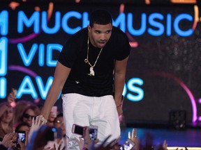 Drake greets fans during the 2013 Much Music Video Awards in Toronto on Sunday June 16, 2013. THE CANADIAN PRESS/Aaron Vincent Elkaim