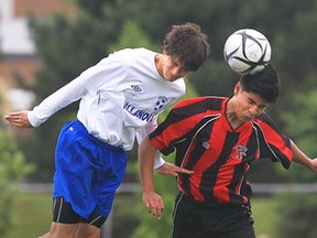 Villanova's Michael Berardi, left, battles Stefan Prasad of   Fr. Leo J. Austin C.S.S. during the OFSAA boys AAA soccer championship at the Vollmer Complex in LaSalle June 6, 2013.  (JASON KRYK/The Windsor Star)