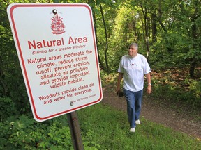 Retired teacher and Windsor environmentalist Tom Henderson, chairman of the public advisory council of Detroit Canadian Cleanup,  walks near the Ojibway Shores forest in West Windsor on June 27, 2013. (JASON KRYK/The Windsor Star)