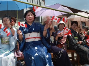 The Fujisawa group and members of the Canada Japan Society take part in the 2012 Canada Day Parade in downtown Windsor. (DAX MELMER / Windsor Star files)