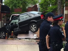 Windsor police investigate the scene of a single motor vehicle accident at the intersection of Victoria Avenue and Elliott Street Sunday morning. Two pedestrians were struck by the vehicle and taken to the hospital with non-life threatening injuries. (DAX MELMER/ The Windsor Star)