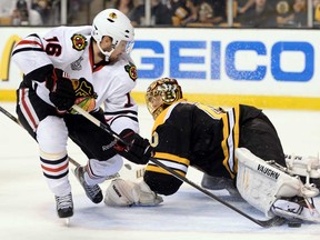 Chicago's Marcus Kruger, left, shoots against Boston goalie Tuukka Rask during Game 4 of the Stanley Cup Final at TD Garden on June 19, 2013 in Boston. (Harry How/Getty Images)