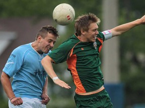 Windsor's Franco Giorgi, left, and Michigan's Zach Steinberger battle for the ball during their exhibition game Tuesday, June 11, 2013, at Windsor Stadium. The Stars beat the Bucks 4-1. (DAN JANISSE/The Windsor Star)