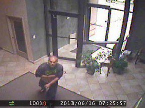 A surveillance camera image of a man who broke into the Deerbrook Realty office on Eugenie Street East. (Handout / The Windsor Star)