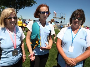 Marcia Fuglewicz, left, Arlene Thompson and Cathy Moroun, are members of the WonderBroads dragon boat team that won the  International Dragon Boat Festival for the Cure in Tecumseh on Saturday, July 13, 2013.  (DAX MELMER/The Windsor Star)
