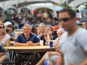 In this file photo, people take in the music during the 2013 Fork and Cork Festival at the Riverfront Plaza on July 6, 2013 in Windsor. (JASON KRYK/The Windsor Star)