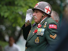 Fred McLachlan salutes at the 60th anniversary of the Korean War armistice at Dieppe Park, Saturday, July 27, 2013. McLachlan served as a medic in the Korean War.  (DAX MELMER/The Windsor Star)
