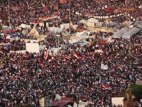 Thousands of Egyptian protesters celebrate in Tahrir Square as the deadline given by the military to Egyptian President Mohammed Morsi passes on July 3, 2013 in Cairo, Egypt. (Photo by Spencer Platt/Getty Images)