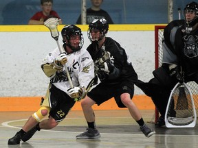 Windsor Clippers captain Jeff Rivait, left, battles Orangeville's Shane Hillis during Junior B lacrosse playoff action at Forest Glade Arena. (JASON KRYK/The Windsor Star)