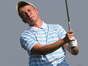 Windsor's Brandon Mihalo eyes a tee shot during the Ontario Junior Boys Golf Championship at Ambassador Golf Club Wednesday. (DAN JANISSE/The Windsor Star)