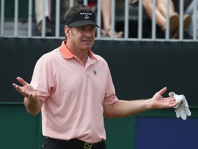 Nick Faldo of England reacts during the first round of the 142nd Open Championship at Muirfield Thursday in Gullane, Scotland.  (Photo by Andy Lyons/Getty Images)