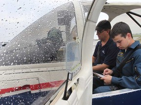 In this file photo, a group of elite Royal Canadian Air Cadets are in Windsor, Ont. this week to receive special flight training. Cadet Roland Naiman, right, of Toronto prepares to take off with trainer Graham Wilson. on Monday, July 22, 2013.  (DAN JANISSE/The Windsor Star)