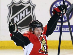 Ottawa Senators Daniel Alfredsson (11)celebrates an overtime win against the Montreal Canadiens after game four of Stanley Cup playoff hockey action on Tuesday May 7, 2013 in Ottawa. THE CANADIAN PRESS/Fred Chartrand