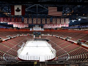 The championship banners of The Detroit Red Wings hang from the rafters above the ice at Joe Louis Arena in this file photo. (Paul Sancya/AP)