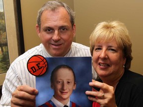 Roch and Rachelle Ethier proudly hold a recent portrait of their son, Daniel Ethier, 14, on Tuesday, July 2, 2013, who fought a couragous battle with cancer.  Daniel was an inspiration and loved by all who met him.  (NICK BRANCACCIO/The Windsor Star)