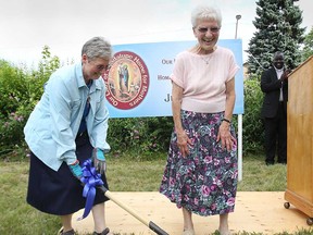 A groundbreaking ceremony was held Tuesday, July 16, 2013, in Windsor, Ont. for the Our Lady of Guadalupe Home for Women in Crisis Pregnancy. The home will be built on Alexandrine Street at Remington Avenue. Sister Linda Dube, left, and Carolyn Cole ceremoniously break ground during the event.   (DAN JANISSE/The Windsor Star)