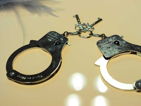 Handcuffs are on display at the "Fifty Shade of Grey" booth, featuring the "official pleasure collection" inspired and approved by best seller author E.L. James, at CurveExpo New York, North America's leading designer lingerie trade show in New York, Feb. 25, 2013.  (EMMANUEL DUNAND/AFP/Getty Images)