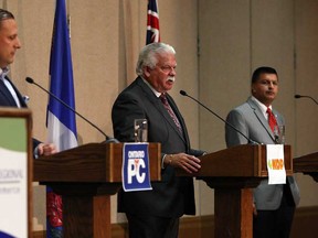 PC candidate Robert de Verteuil, left, NDP candidate Percy Hatfield and Liberal candidate Jeewan Gill take part in the Windsor-Essex Regional Chamber of Commerce debate for candidates in the Windsor-Tecumseh byelection at the Caboto Club in Windsor on Thursday, July 18, 2013.            (TYLER BROWNBRIDGE/The Windsor Star)