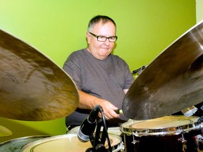 Dan Laskowski plays on his drumset in the basement of his Windsor, Ont. home Sunday, July 21, 2013. The 57-year-old drummer took third place in the Battle of the Feet at the annual Extreme Sport Drumming competition in Nashville on July 13. (JOEL BOYCE / The Windsor Star)