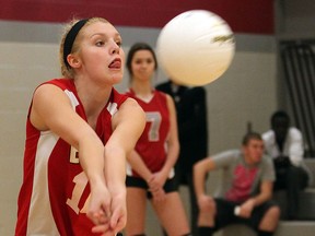 Emily McCloskey of the Essex Raiders returns a shot against the Brennan Cardinals in high school volleyball action. (NICK BRANCACCIO/The Windsor Star)