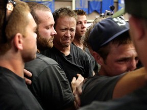 Firefighters gather during a memorial service Monday, July 1, 2013, in Prescott, Ariz., honoring their 19 fellow firefighters killed battling a wildfire near Yarnell, Ariz., Sunday. All but one of the Prescott-based Granite Mountain Hotshots' 20 members died Sunday when a wind-whipped wildfire overran them on a mountainside north of Phoenix. (AP Photo/Chris Carlson)