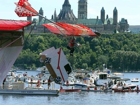 The Eh Team from LaSalle, Ont., jumps in the Red Bull Flugtag at the Museum of Civilization in Gatineau, July 27, 2013. (Jean Levac/OTTAWA CITIZEN)