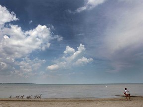 The Fraser Institute says the quality of the Great Lakes water is improving despite a summer of beach closures. The Sand Point Beach in Windsor, Ont. was closed Wednesday, July 17, 2013. Lifeguard Nadia Timperil and a few Canada geese were the only life in the area.  (DAN JANISSE/The Windsor Star)