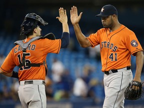 Pitcher Jose Veras, right, is seen in this file photo. (Photo by Tom Szczerbowski/Getty Images)